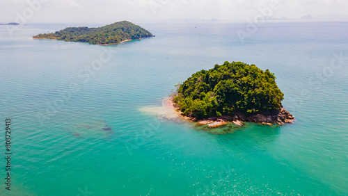 Small island in the sea with beautiful blue waters, southern Thailand, Asia photo