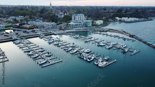 Port Washington Harbor And Marina; 4K Aerial Pan Over The Old Historic Downtown City Landscape. photo