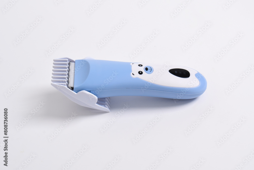 Wireless hair trimmer for babies and children isolated on a white background. Wireless hair trimmer for babies and children isolated on a white background.