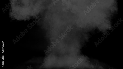 a powerful explosion with a lot of smoke on a black background photo