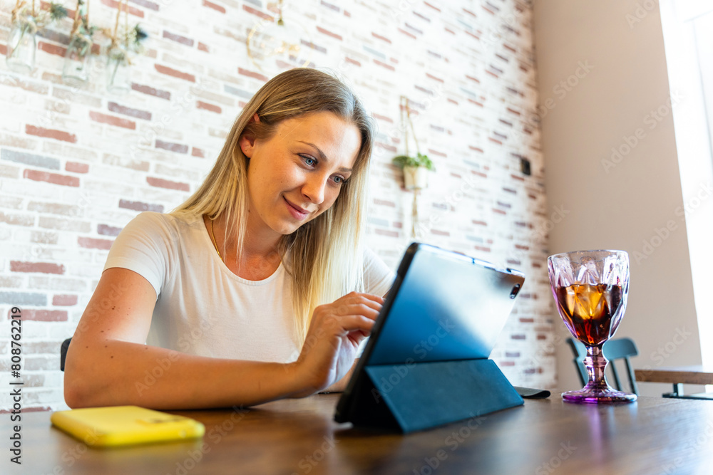 Business woman teleworking from a cafe Business woman teleworking from a cafe
