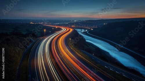 A long exposure photo of the lights from cars on a motorway at night