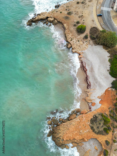 Drone view of Tres Platges, pebble, turquoise beach in Alcossebre, Castellon province, Spain
 photo