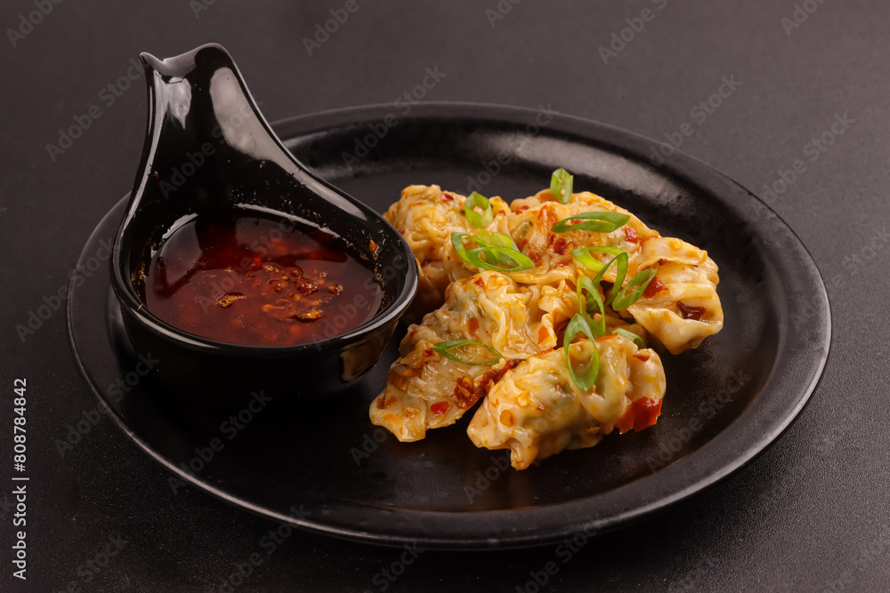 Φωτογραφία Pangsit Chili Oil is Dimsum or Wonton With Garlic Chili Oil.