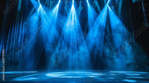 The stage is lit by blue spotlights
