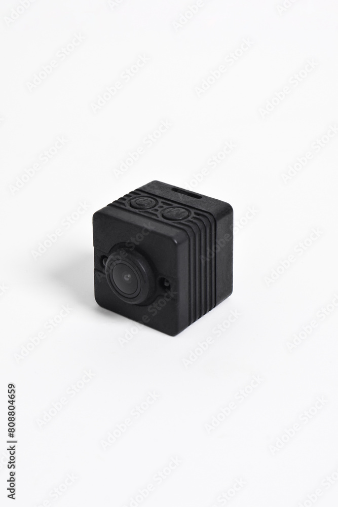 Closeup spy camera isolated on white background. Black security camera, Mini spy camera