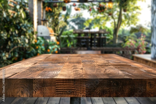 A wooden table beside a window with trees in the background