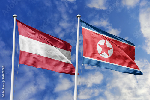3d illustration. Austria and North Korea Flag waving in sky. High detailed waving flag. 3D render. Waving in sky. Flags fluttered in the cloudy sky. photo