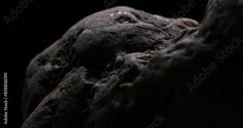 Meteorite-like Boulders Against the Void. Close-up, shallow dof.