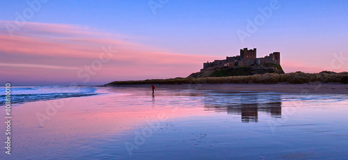 Sunset on Bamburgh Castle, on the northeast coast of England, by the village of Bamburgh in Northumberland