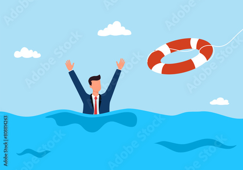 Drowning businessman hand in water getting lifebuoy from another businessperson helping business to survive support rescue concept.