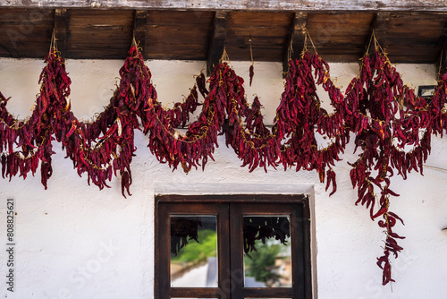 red peppers drying on a facade, Cazorla town, Natural Park of the Sierras de Cazorla, Segura and Las Villas, Jaén province, Andalusia, Spain photo