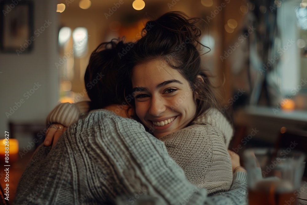 Man and Woman Hugging at Table Man and Woman Hugging at Table