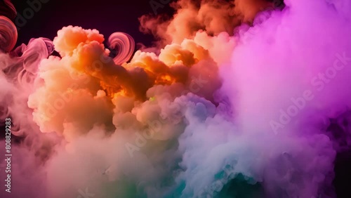 Colored smoke looks exceptionally intense, creating an abstract form that hypnotizes and delights with its colors. photo