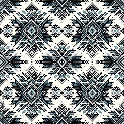 Tribal Aztec fabric with an Ikat style seamless pattern in black and light blue on a white background
