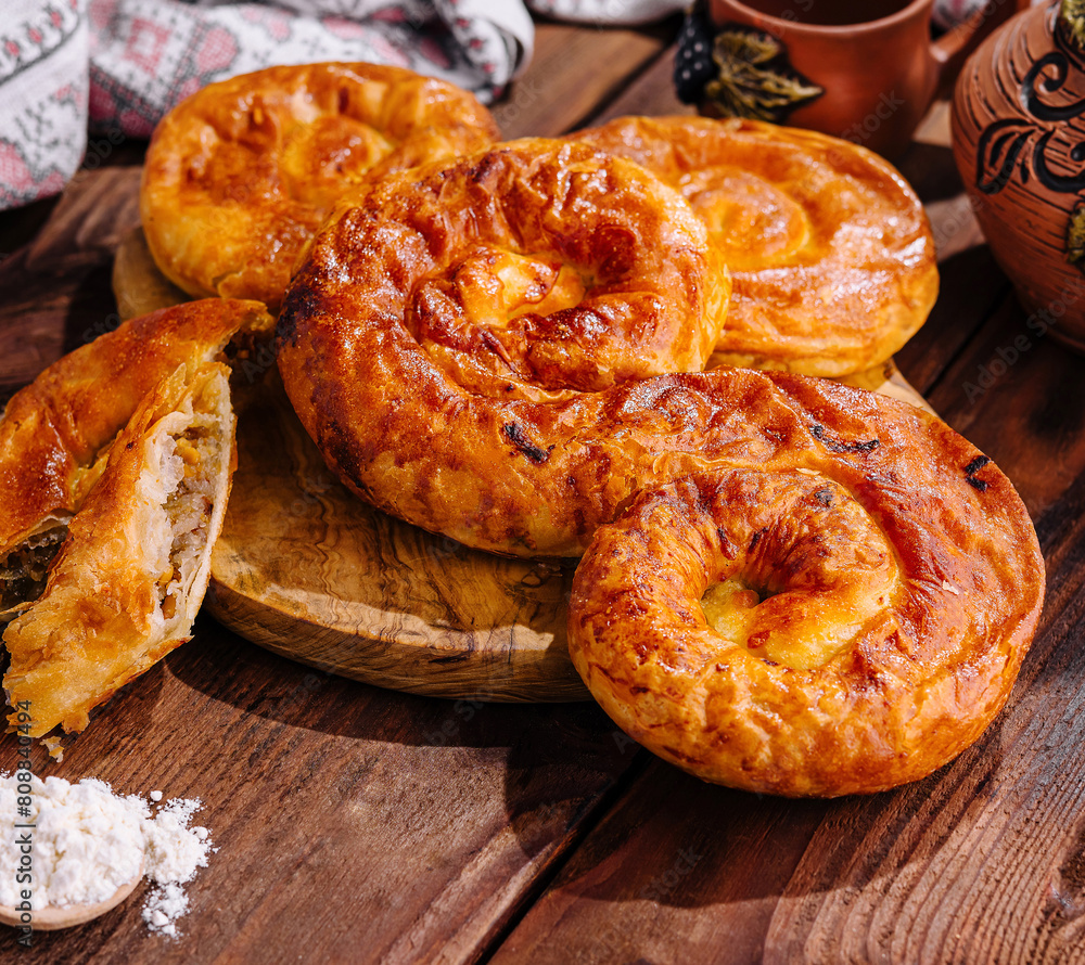 Traditional baked apple pies on wooden table Traditional baked apple pies on wooden table
