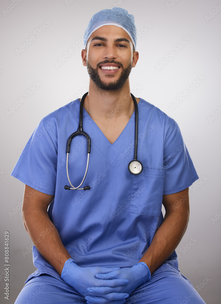Studio, man and nurse in portrait with smile, professional and relax by white background. Male surgeon, confidence and gloves for bacteria, virus or illness protection with regulations for healthcare Studio, man and nurse in portrait with smile, professional and relax by white background. Male surgeon, confidence and gloves for bacteria, virus or illness protection with regulations for healthcare
