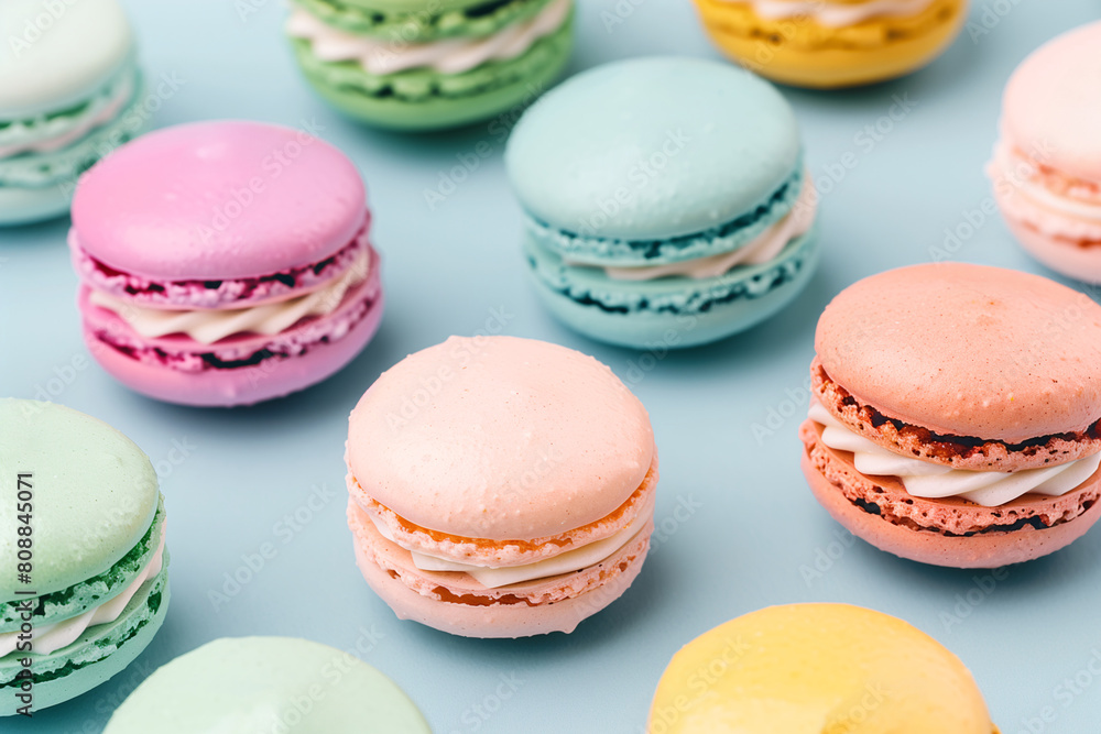 Colorful macaron desserts on a pastel light blue background Colorful macaron desserts on a pastel light blue background