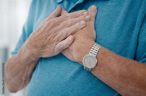 Senior man, heartburn and hands for heart attack, home and stress on lungs or anxiety emergency. Elderly male person, pain and cardiovascular stroke or asthma, cardiac arrest and disease in closeup