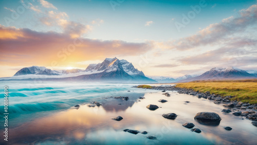 Panoramic view of a beautiful cold landscape. Lake with mountains in the background at sunset. Lake with reflections.