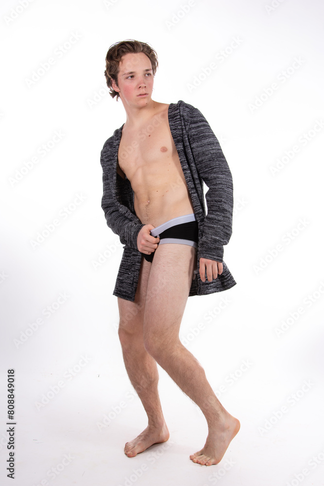 Fototapeta premium Young attractive sporty guy posing on a white background.