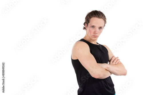 Young attractive sporty guy posing on a white background.