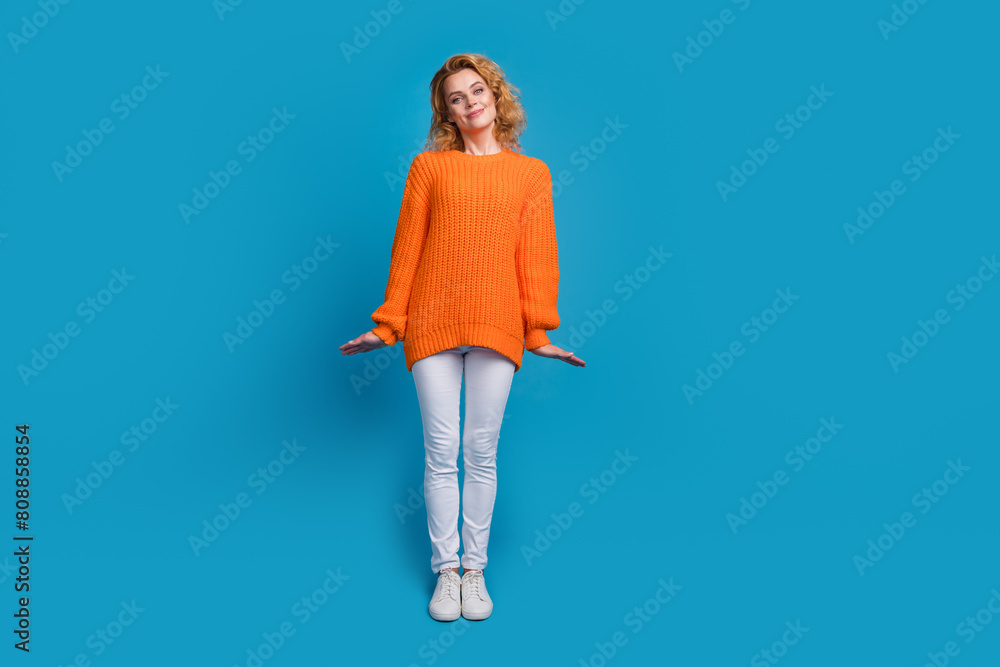 Φωτογραφία Full length photo of pretyt cute woman wear trendy orange clothes isolated on bl