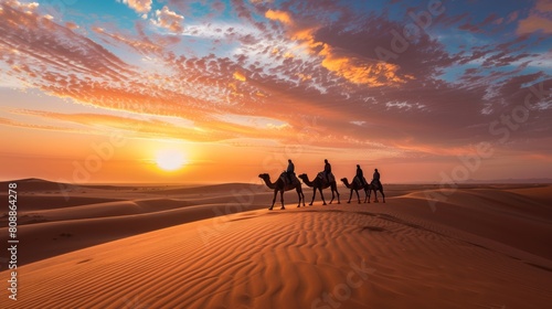 Beautiful caravan of camels as they trek through vast sandy desert beneath a stunning clear blue sky