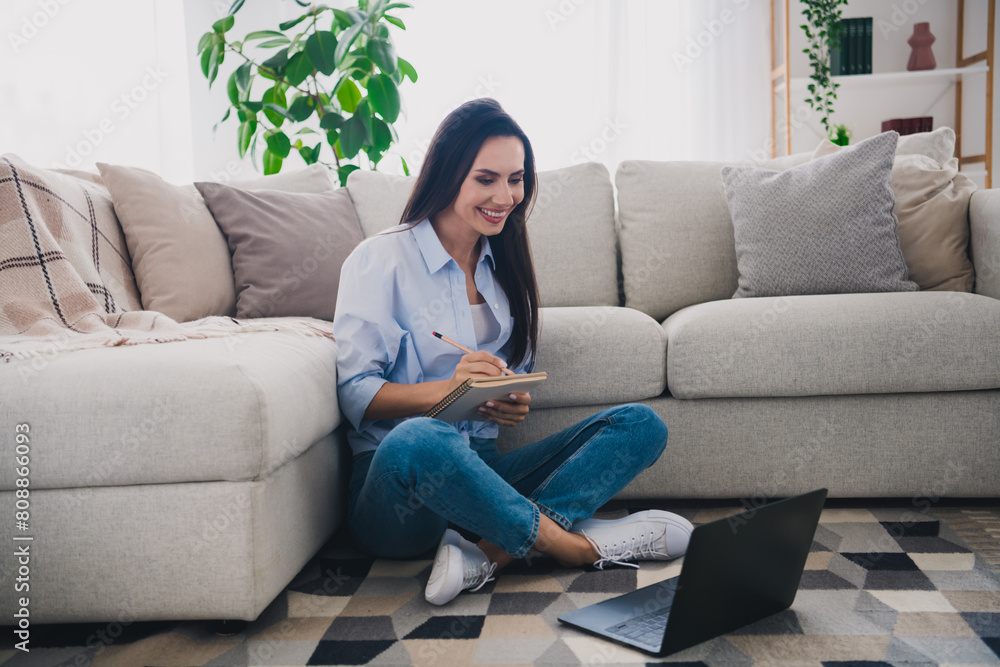 Full size photo of nice lady sit floor hold notepad use netbook wear blue shirt bright interior flat indoors Full size photo of nice lady sit floor hold notepad use netbook wear blue shirt bright interior flat indoors