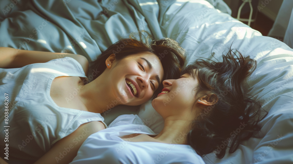 LGBT concept, Asian gay lover, just married homosexual couple lying on bed together in bedroom. Playing and smile laughing with happiness and kissing on forehead. Happy gay and lesbian lifestyle. Stoc LGBT concept, Asian gay lover, just married homosexual couple lying on bed together in bedroom. Playing and smile laughing with happiness and kissing on forehead. Happy gay and lesbian lifestyle. Stoc