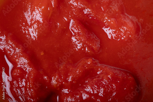 Food background, tomato sauce texture, top view, close-up and space for text