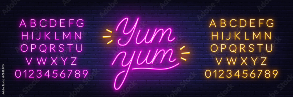 Yum Neon Sign on brick wall background.