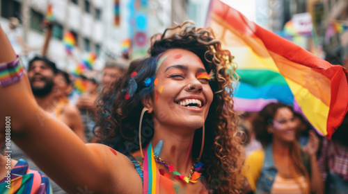 People participate in the pride parade. Multi-ethnic people in the city street with a woman waving gay rainbow flag. Stock Photo photography photo