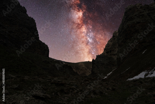 Bright milky way galaxy over the mountains. Night landscape. 