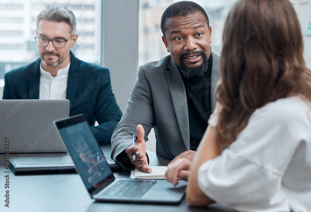 Black man, manager and mentor with laptop for instruction in office for meeting, strategy and discussion in workplace. Business people, coaching and computer on desk for planning, support and guiding Black man, manager and mentor with laptop for instruction in office for meeting, strategy and discussion in workplace. Business people, coaching and computer on desk for planning, support and guiding