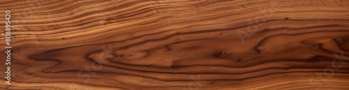 High-resolution image showcasing the beautiful, flowing grain of walnut wood. Ideal for backgrounds, patterns, and design projects emphasizing organic, natural, and high-quality wood textures © Enigma
