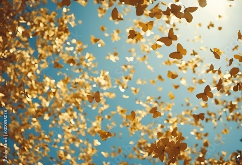 Golden butterflies flying in the sky