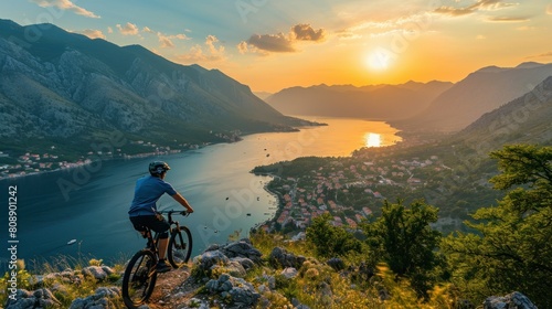Male mountainbiker at sunset in the mountains © Ruslan Gilmanshin