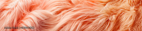 Horizontal image of orange colored artificial fur close-up
