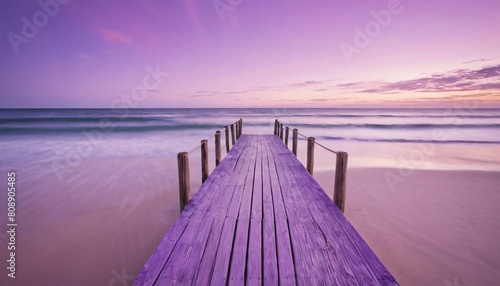 wooden dock pier at a beach under a purple sky