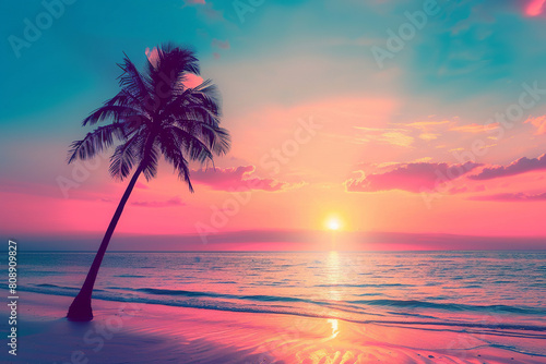 colorful gradient sunset with one palm tree extending above sunset with beach in the background