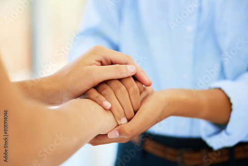 Holding hands, support and trust with people in office for helping others, sympathy and compassion. Team, praise and resilience with closeup of employees in agency for faith, solidarity and empathy
