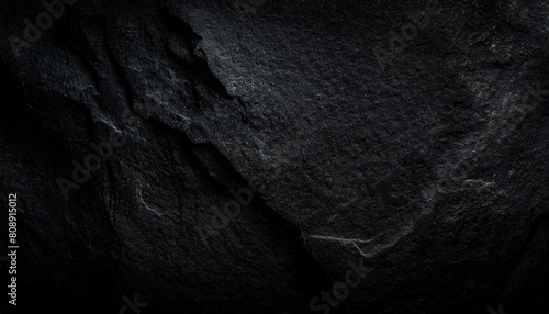 Grunge texture of a rough surface with coarse grain, dust, dirt and noise. Abstract monochrome rough background.