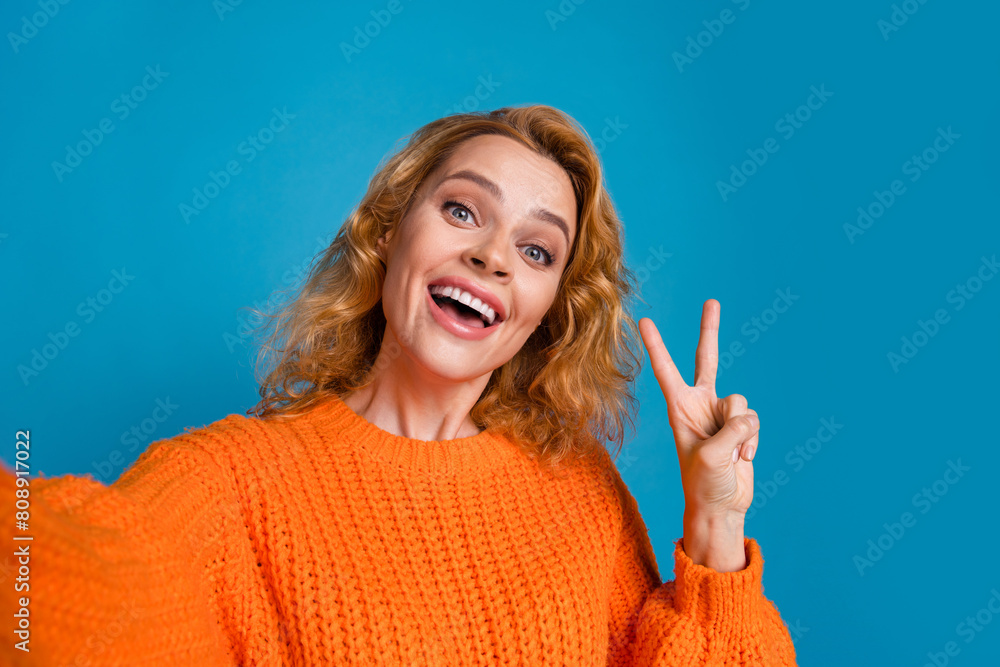 Obraz na plátně Photo of adorable funky woman wear trendy orange clothes recording video v-sign
