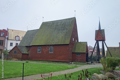 Ancient Bosebo kyrka red wooden church in culture museum in Lund, Sweden in autumn weather