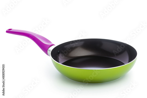 a pan with a handle on a white surface