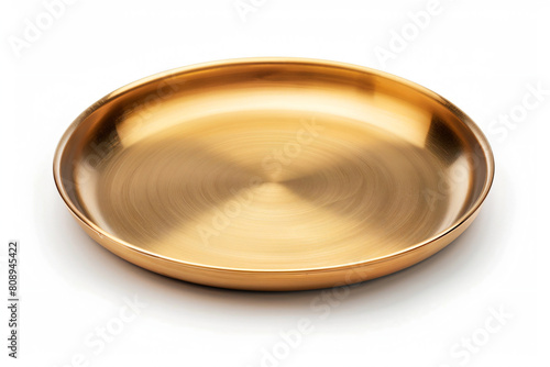 a gold plate on a white surface