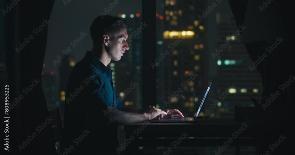 30 years old caucasian person works computer late night focus determination side view. Millennial caucasian person working laptop sitting table home office productivity late night work apartment.