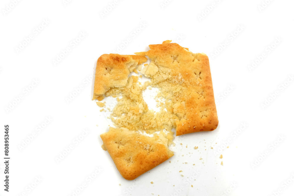crushed malkist crackers on a white background