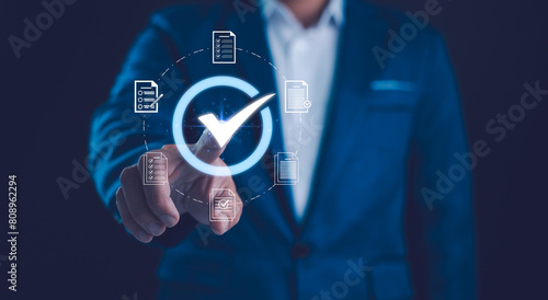 Quality control Businessman touch on virtual correct sign or tick mark with document icon for approve quality assurance and guarantee concept, online approve paperless and quality assurance concept.